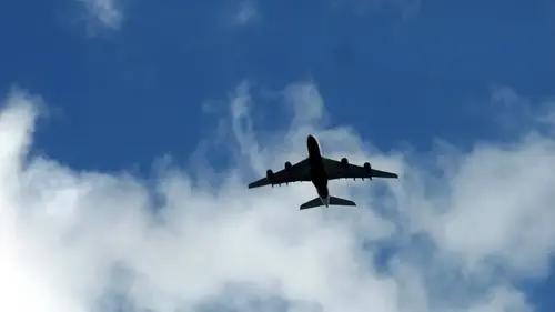 Airplane against clear sky